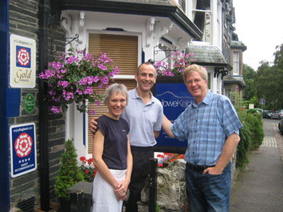 David and Val with Rick Steves outside Howe Keld during a visit
